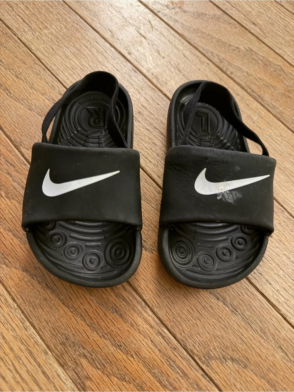 Nike Kids Black Slide Sandals with White Swoosh Logo